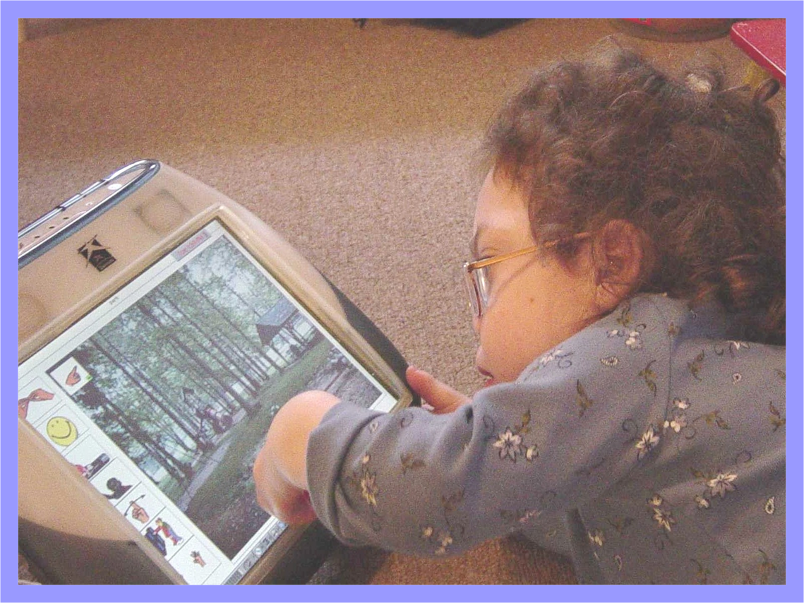 Easy-to-use AAC, child accessing touch screen