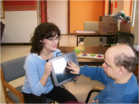Older communicators:  JF and Kathy use AAC to share a conversation.